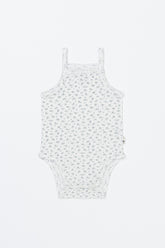 Avauma Lily Sleeveless Bodysuit Cream Blue product shot. Lay-flat of white sleeveless baby romper with small blue floral print on a white background.